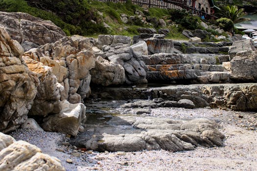 Natural rock formations with unique textures by the coast in Hermanus, South Africa.