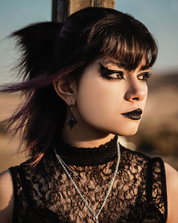 Young Woman in a Black Dress and Black Lipstick Posing Outside Free Stock Photo Young Woman in a Black Dress and Black Lipstick Posing Outside Free Stock Photo