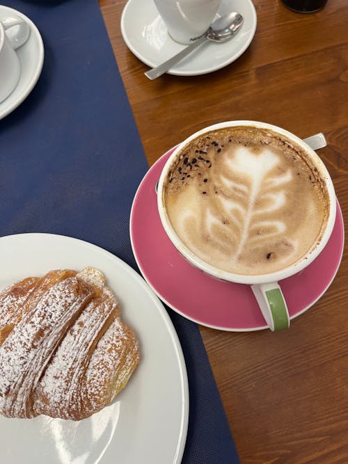 Coffee and Roll Served in a Coffee Shop 