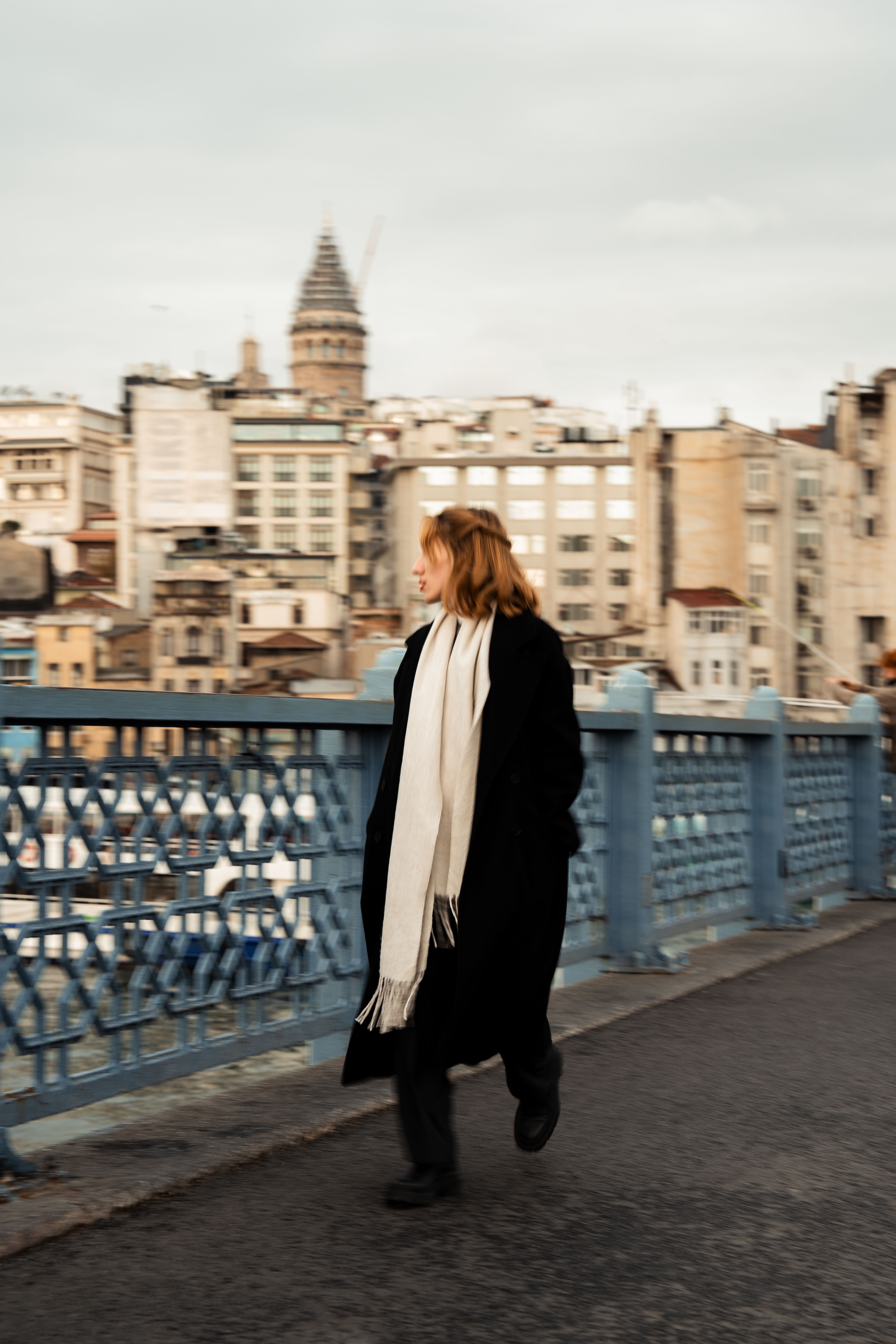 Woman in Black Coat Walking down a Street · Free Stock Photo