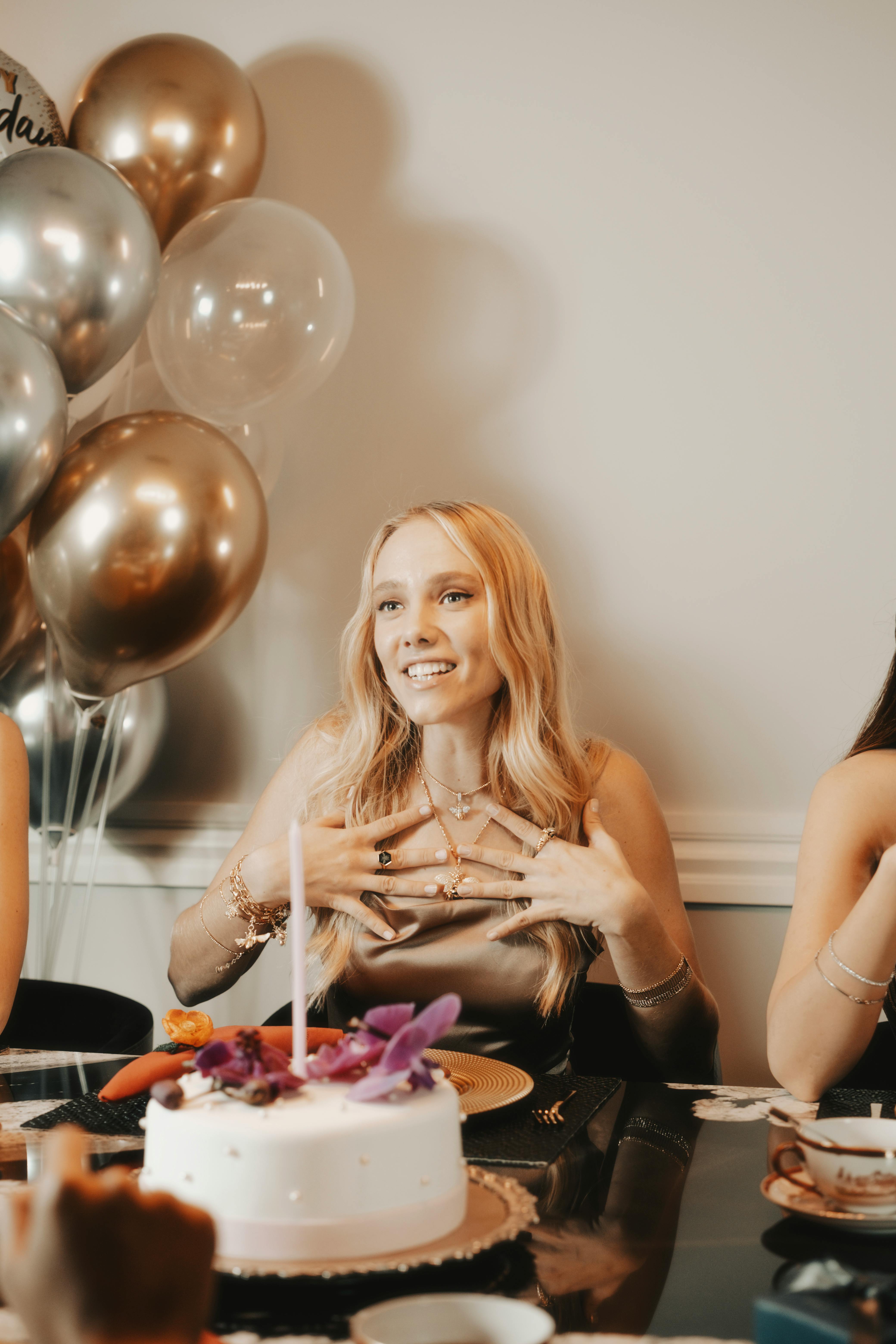 Happy Birthday. Girl With Balloons And Cake At Party Stock Photo