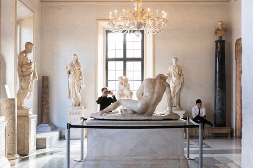 Free Explore the classic Roman sculptures in a grand indoor gallery with elegant interior design. Stock Photo