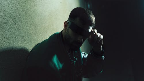 Portrait of Man Wearing Sunglasses in a Shadow 