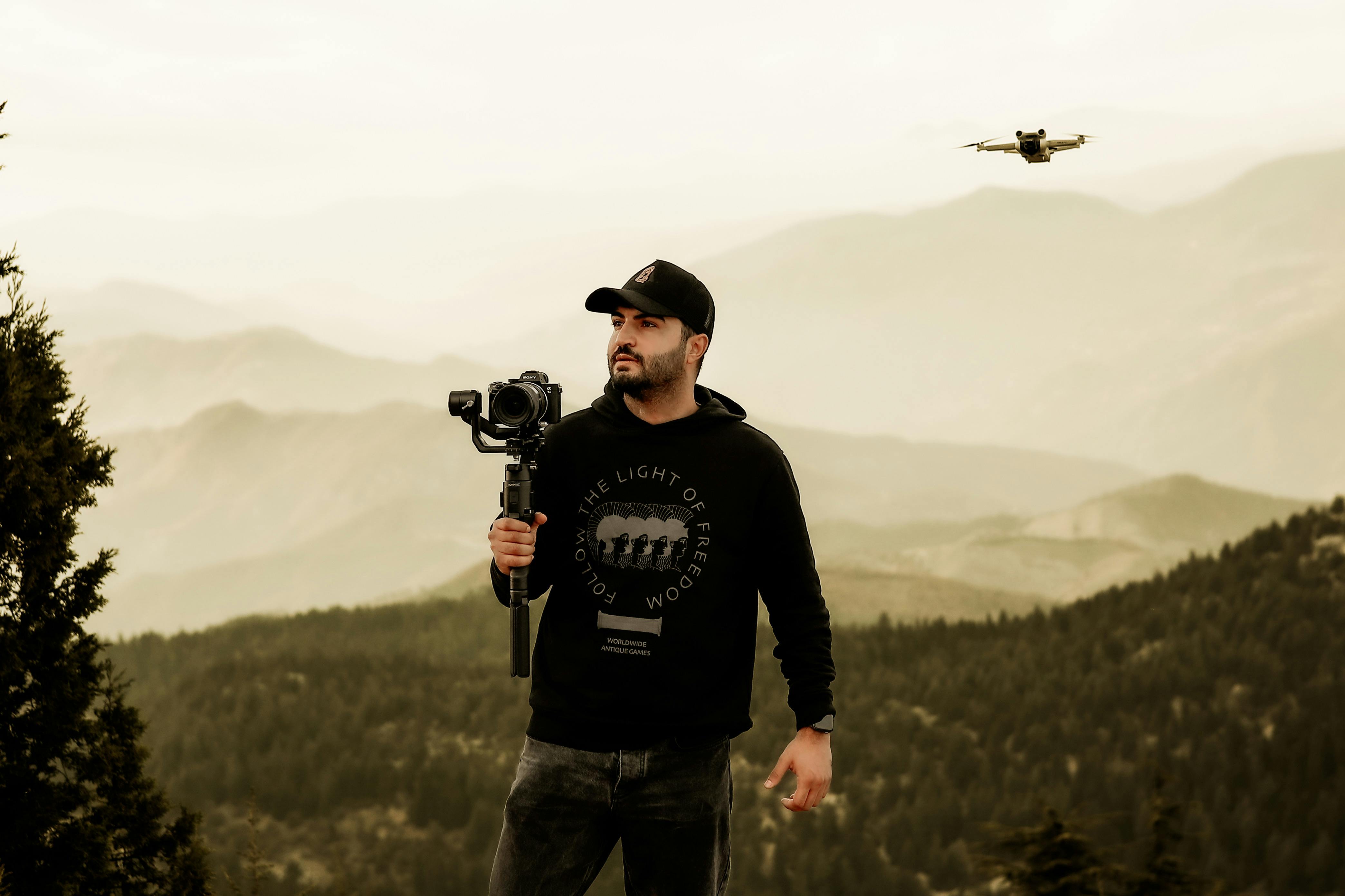 bearded man with camera on tripod