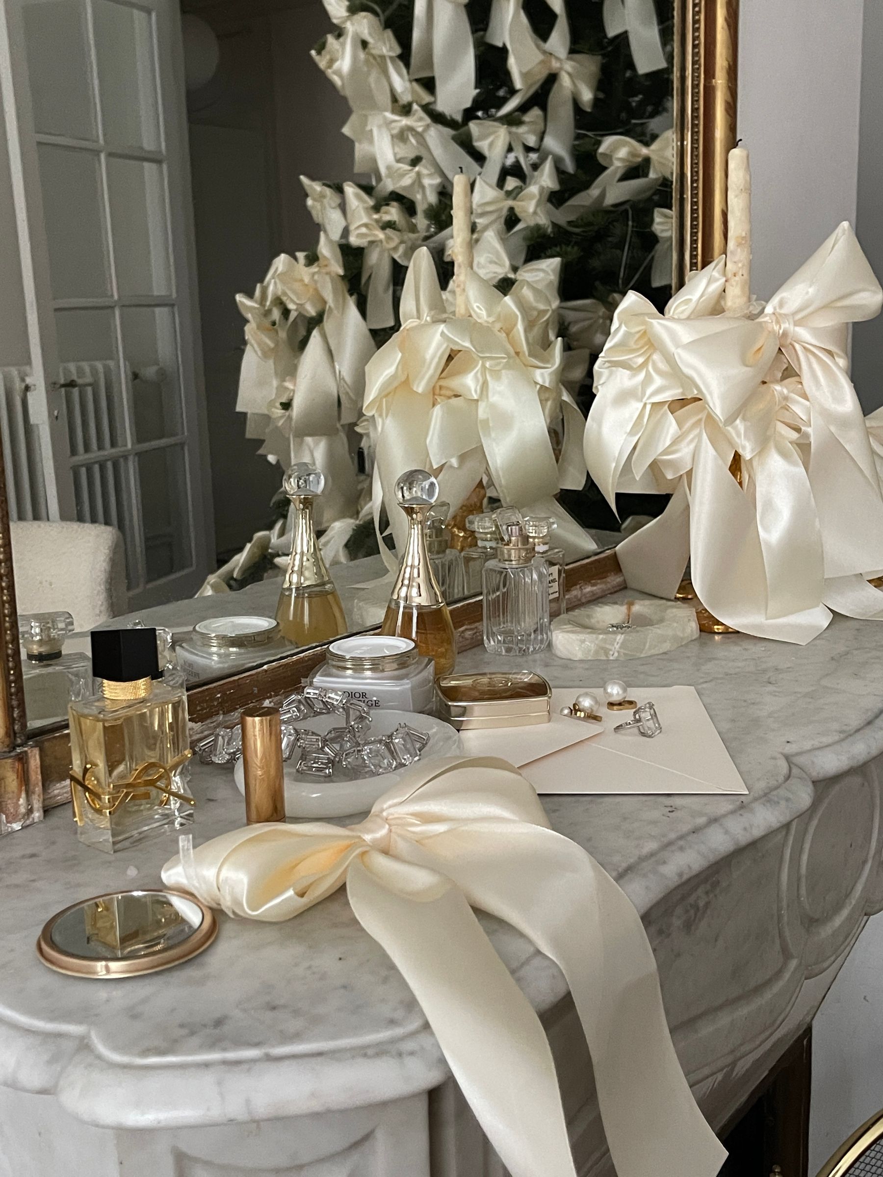 Asymmetrical blue and white Christmas mantel arrangement