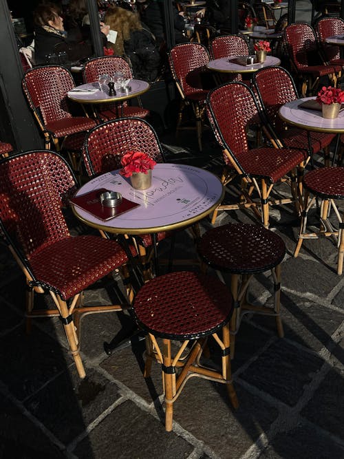 Tables and Chairs Standing Outside of a Restaurant 