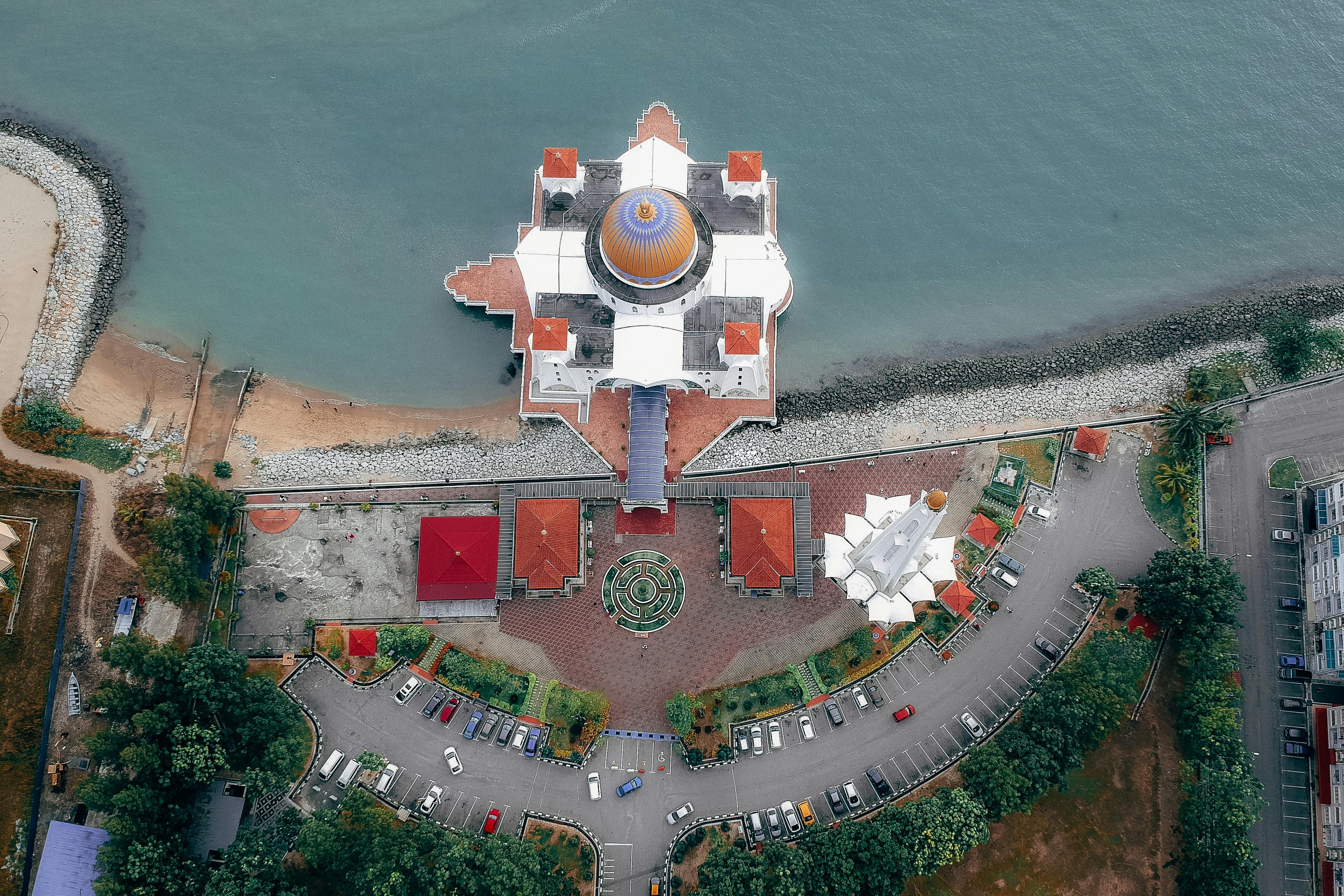 Top View of Mosque Near Body of Water · Free Stock Photo