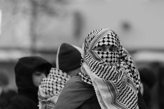 Black and white portrait of a peaceful protester wearing a keffiyeh in Jönköping, Sweden.