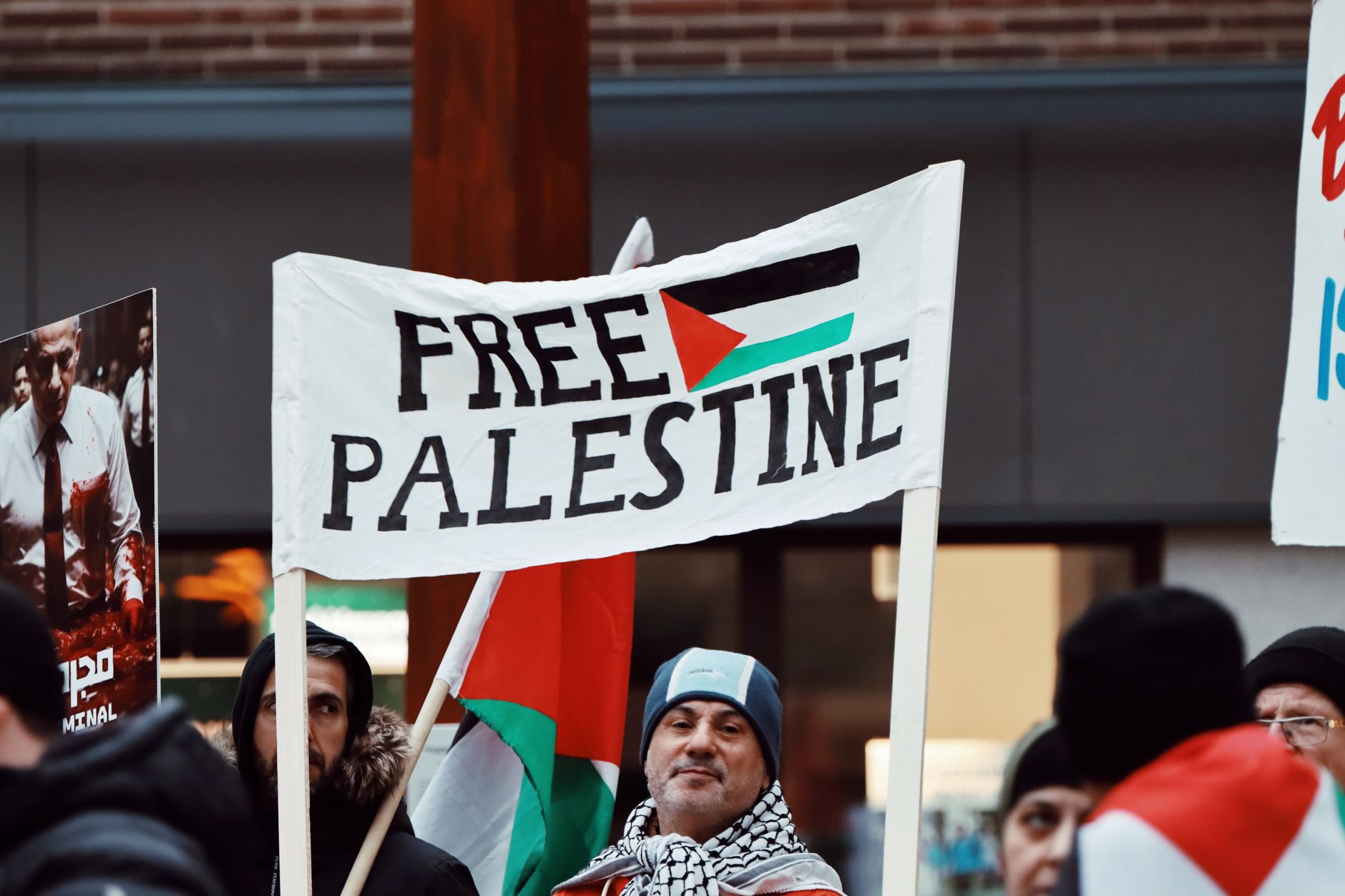 Protesters in Jönköping advocate for Free Palestine with visible signs.