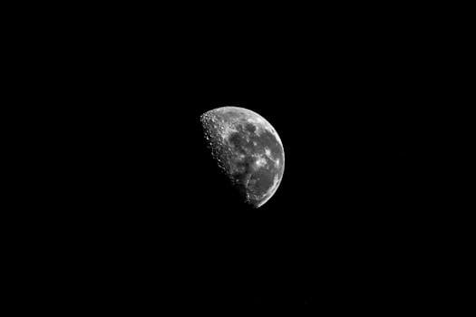 Stunning black and white half moon in Aracati, Brazil, captured at night.
