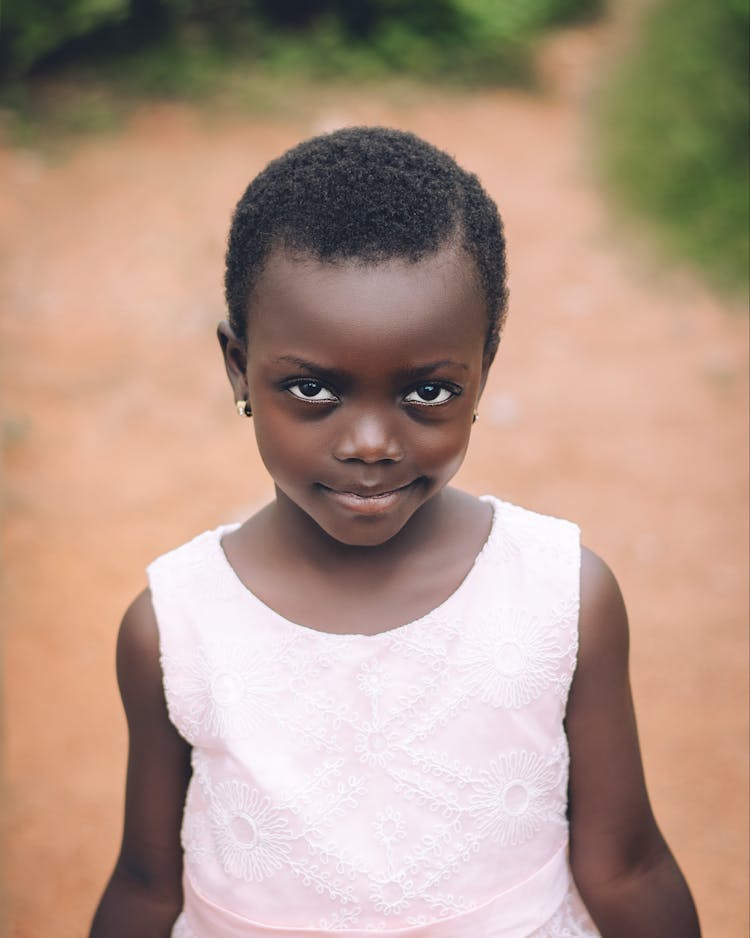 Portrait Of A Little Girl Standing Outside 