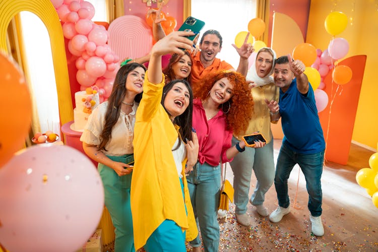 Joyful Group Taking Selfie During A Party