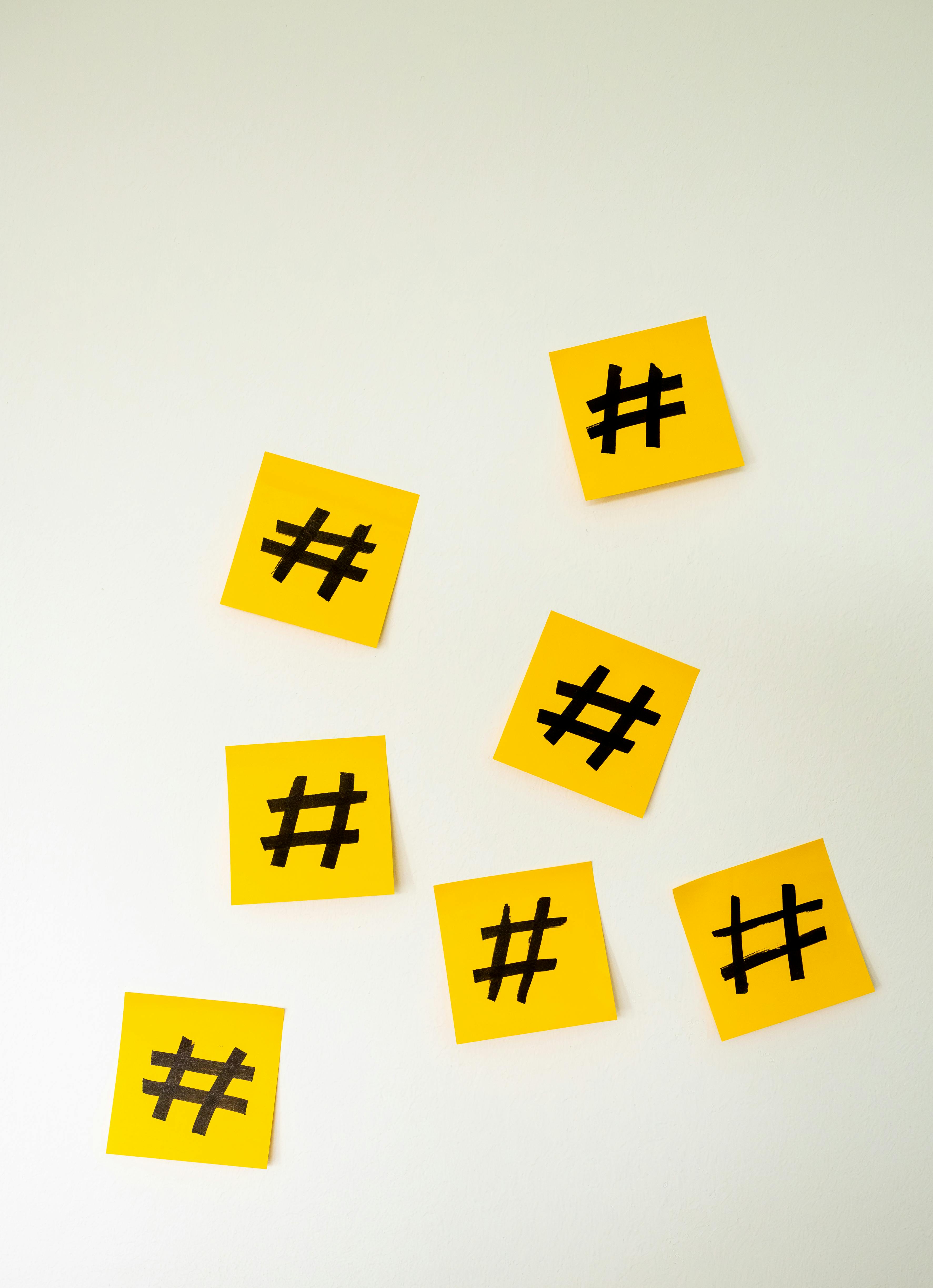 A wall full of sticky notes with hashtags on them · Free Stock Photo