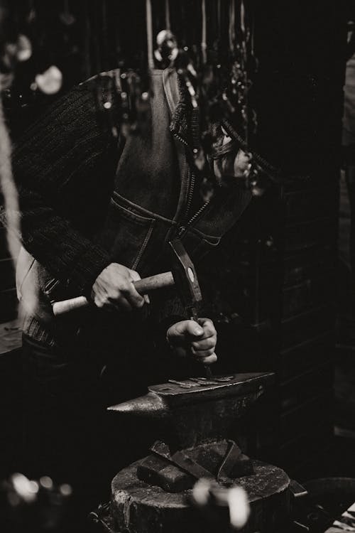 Black and White Photo of a Blacksmith at Work 