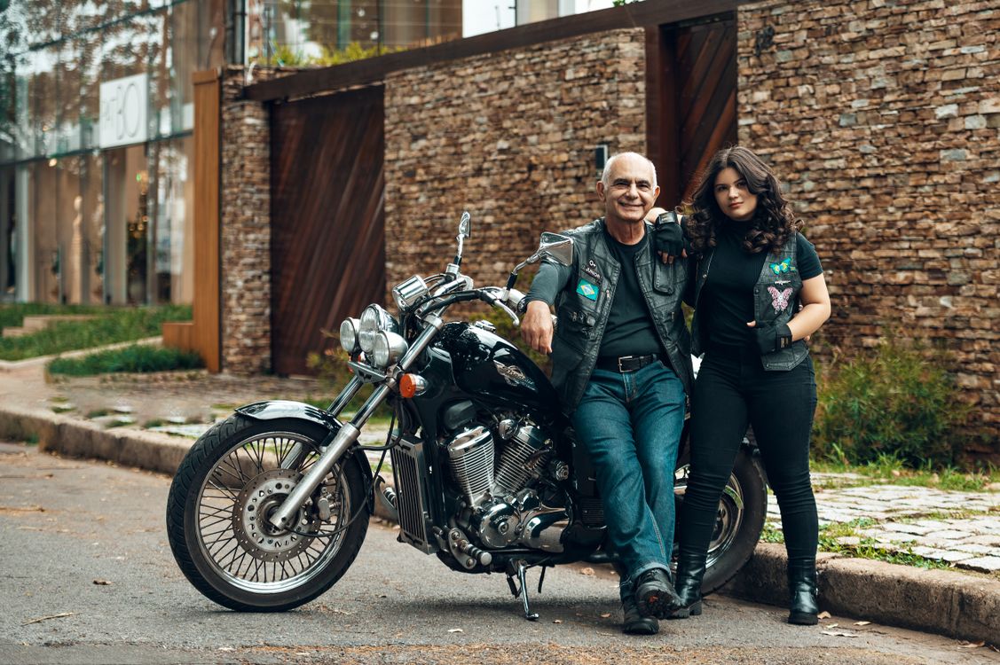 Father and Daughter Standing next to a Motorcycle and Smiling · Free Stock Photo