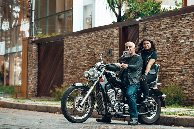 Woman And Man On Motorbike