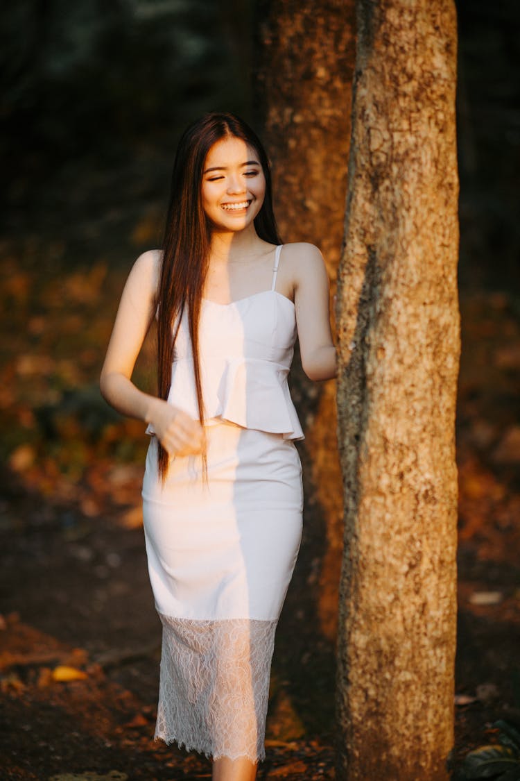 Smiling Woman In White Clothes And Skirt