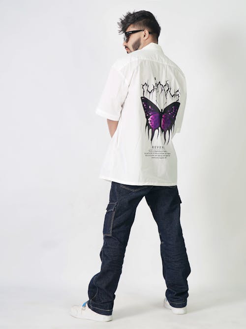 Model in a White Shirt with a Purple Butterfly Print and Denim Cargo Pants