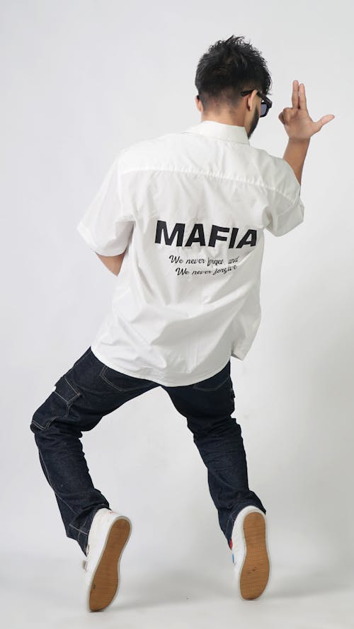 Model Posing in Shirt with Mafia Sign 