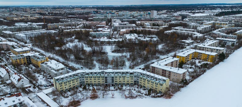 A captivating aerial shot of a snow-blanketed neighborhood in Munich, Germany.
