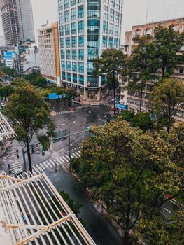 Discover Ho Chi Minh City from above, featuring bustling streets and high-rise buildings.