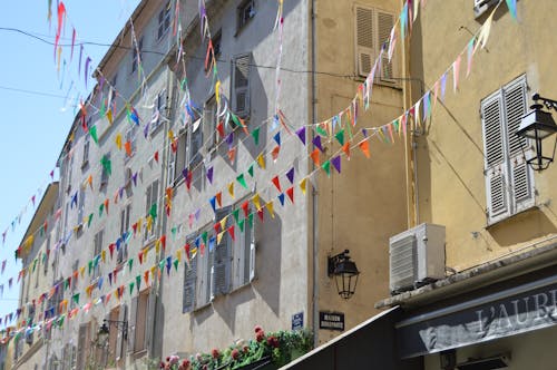 Colorful Flags in front of Building Facade