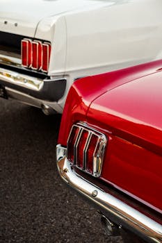 Retro red and white muscle cars highlighting their iconic taillights.