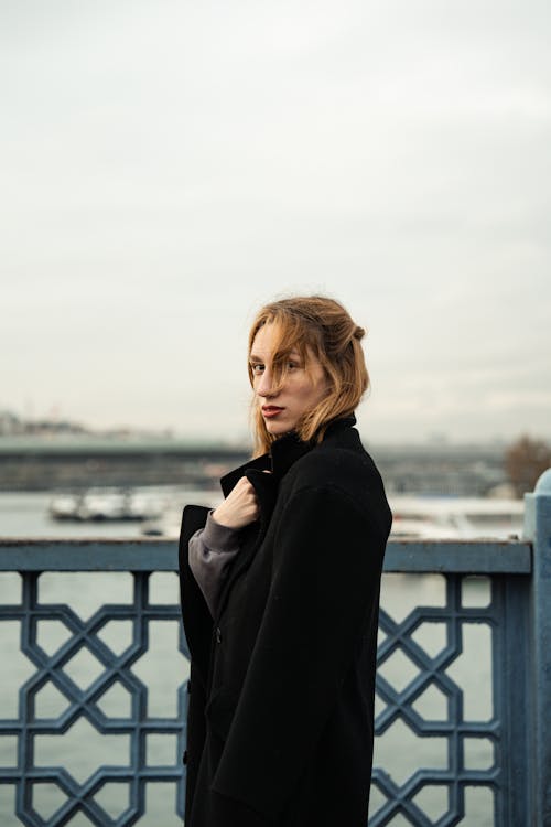 Young Woman Standing on the Bridge 