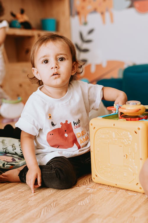 Girl Sitting with Toys