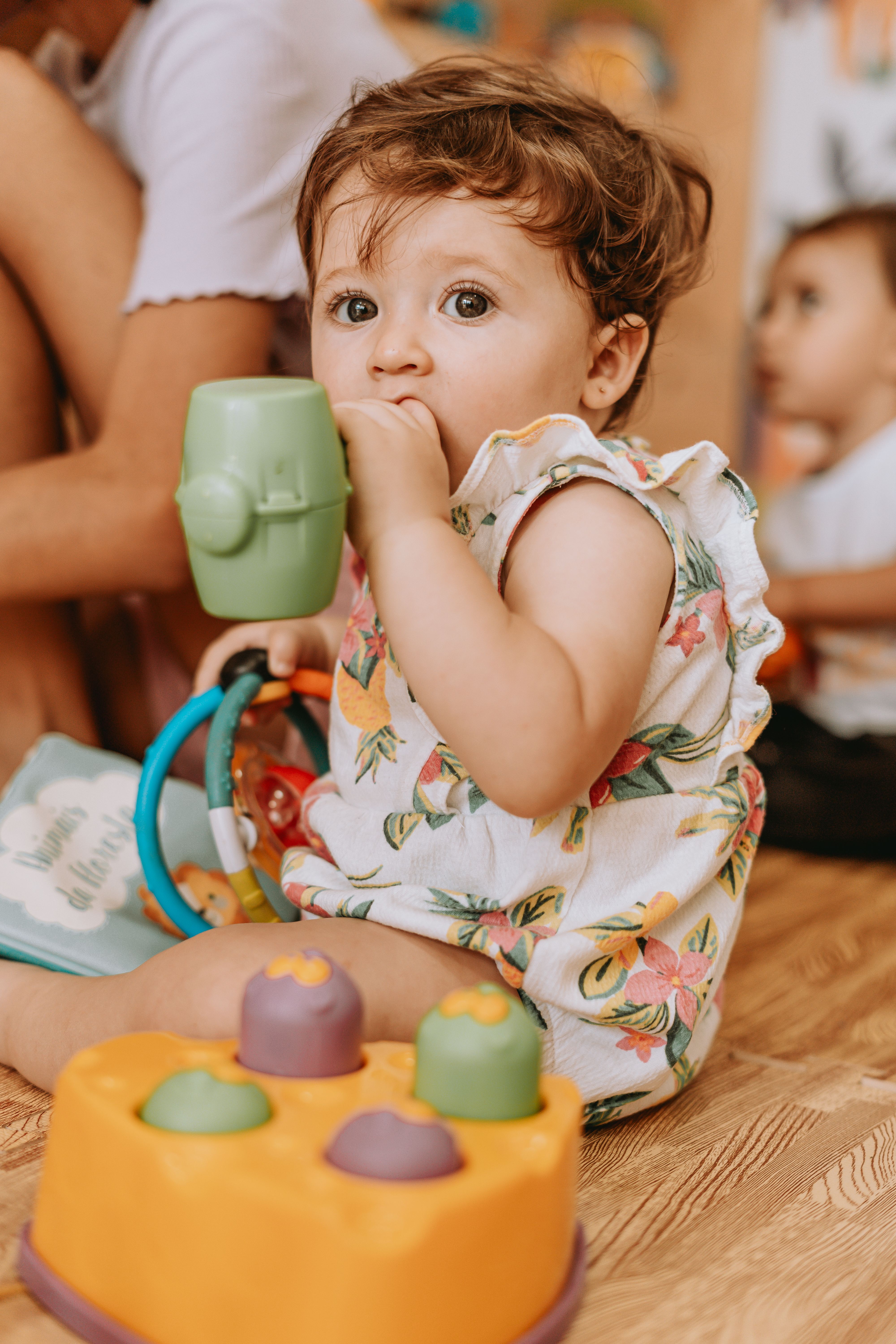 Baby Girl Sitting with Toys · Free Stock Photo
