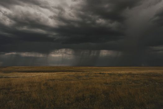 Dramatic storm clouds over grassland in Wagon Mound, New Mexico, USA.