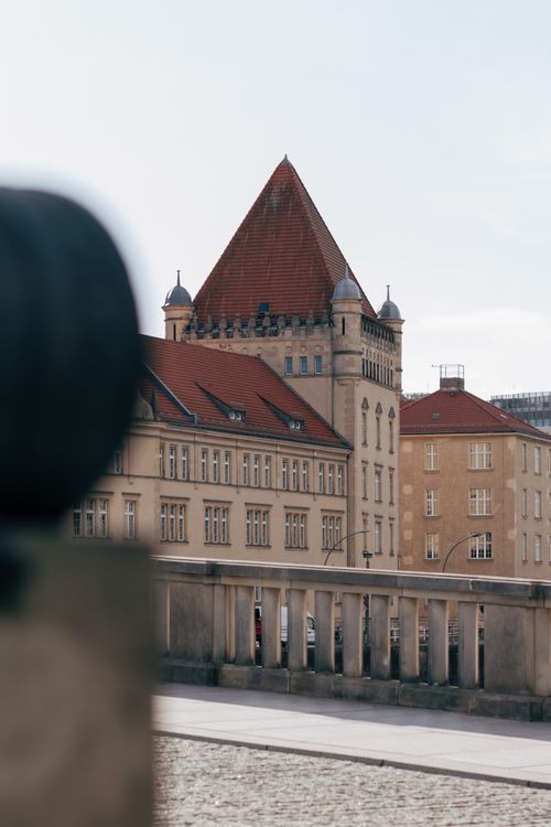 Free View of historic architectural buildings with iconic red roofs in Berlin, Germany. Stock Photo