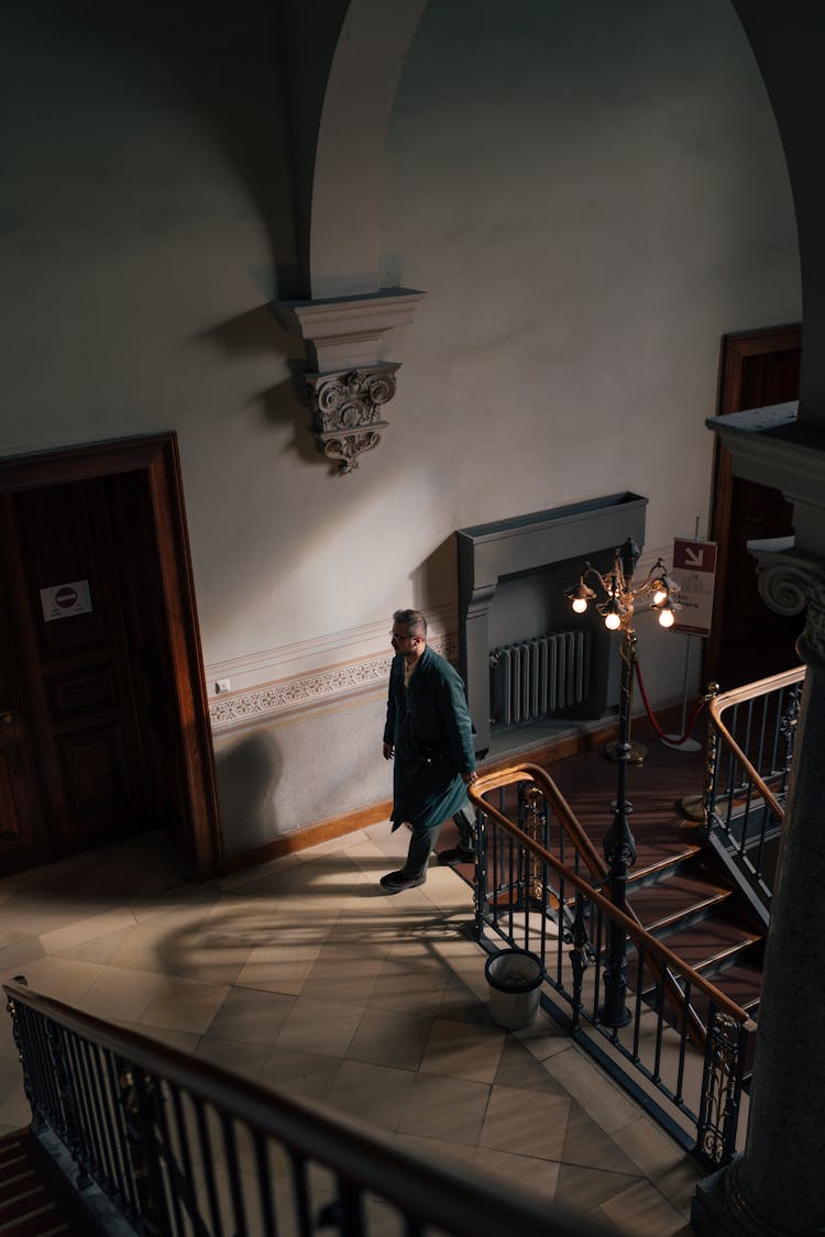 Man On The Staircase Of The Neues Museum In Berlin