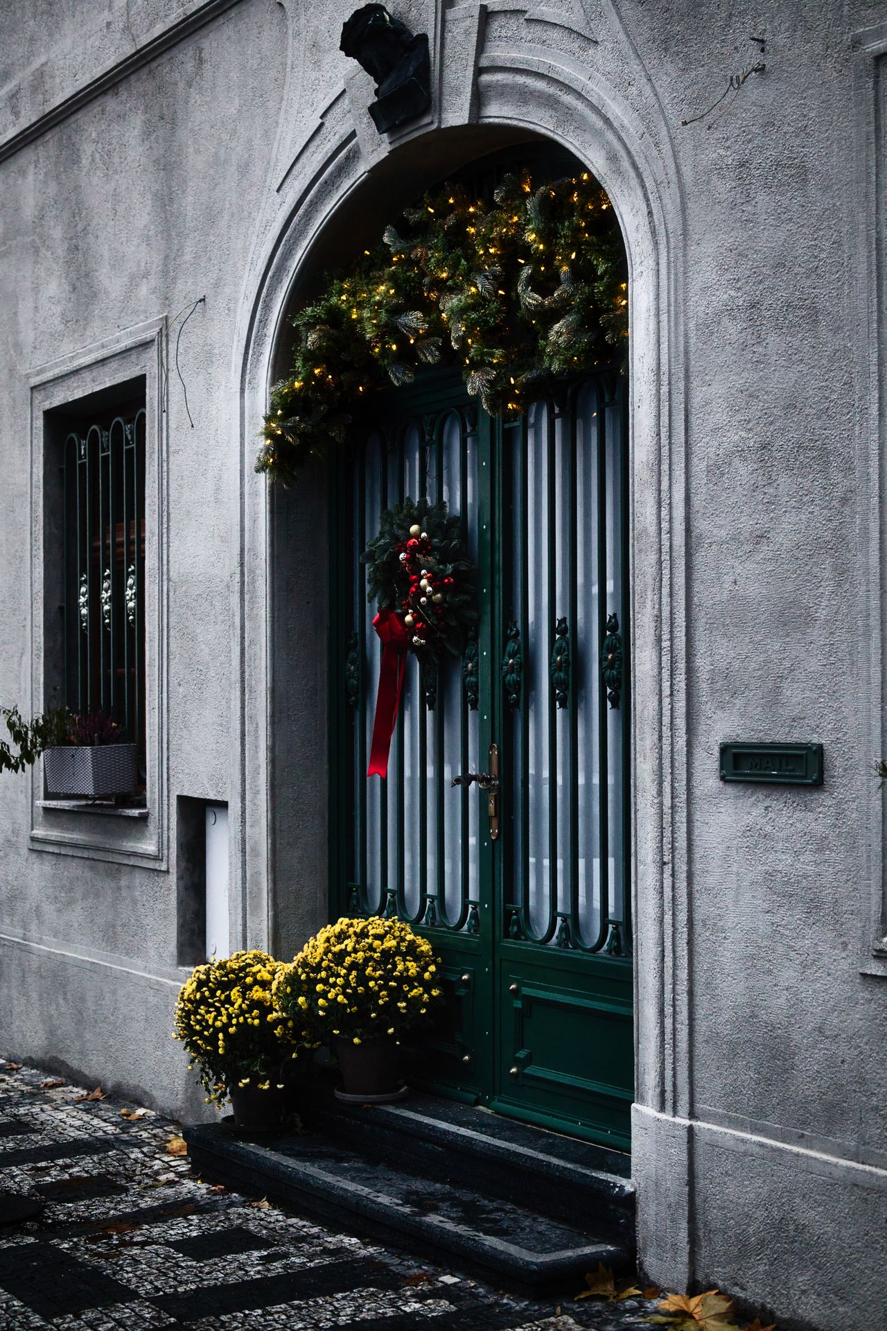 patriotic-wreath-for-the-front-door A decorated front door with a wreath and greenery
