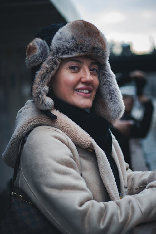 Woman Wearing Furry Hat on City Street