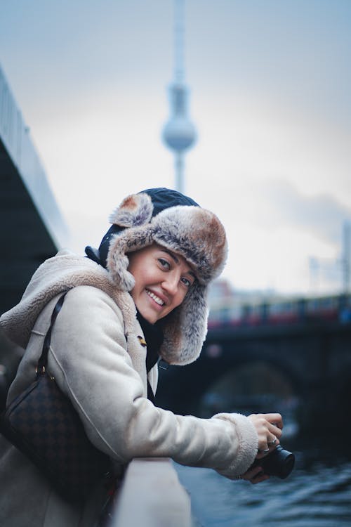 Woman Wearing Furry Hat on City Street