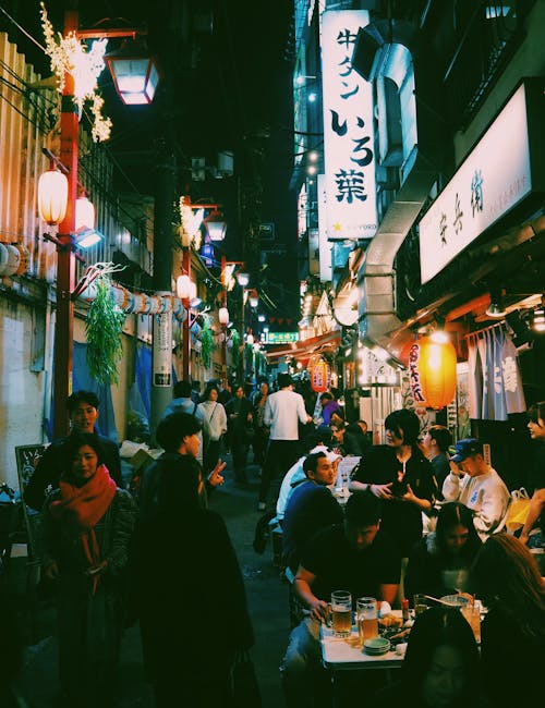 People in a Narrow Restaurant Alley of a Japanese City
