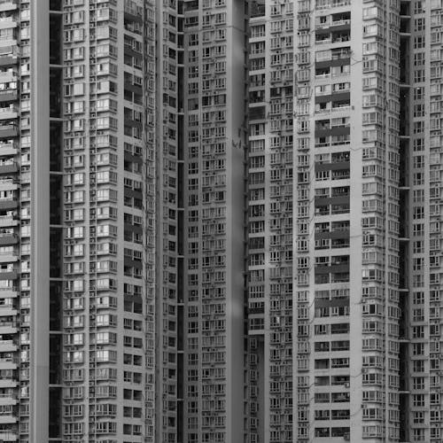 Black and White Photo of a Tall Apartment Building 