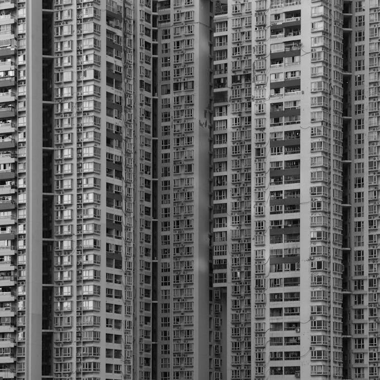 Black and White Photo of a Tall Apartment Building 