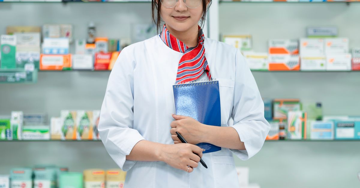A young pharmacist in a drugstore