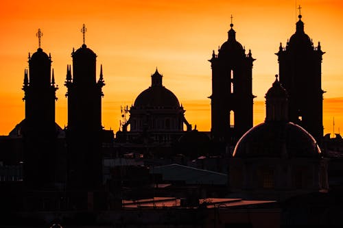Bell Towers and Domes of Churches Sgainst the Golden Sky at Sunset