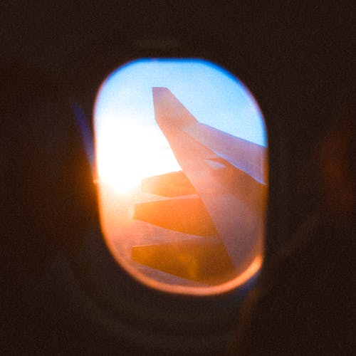 View of Bright Sun through the Window of an Airplane 