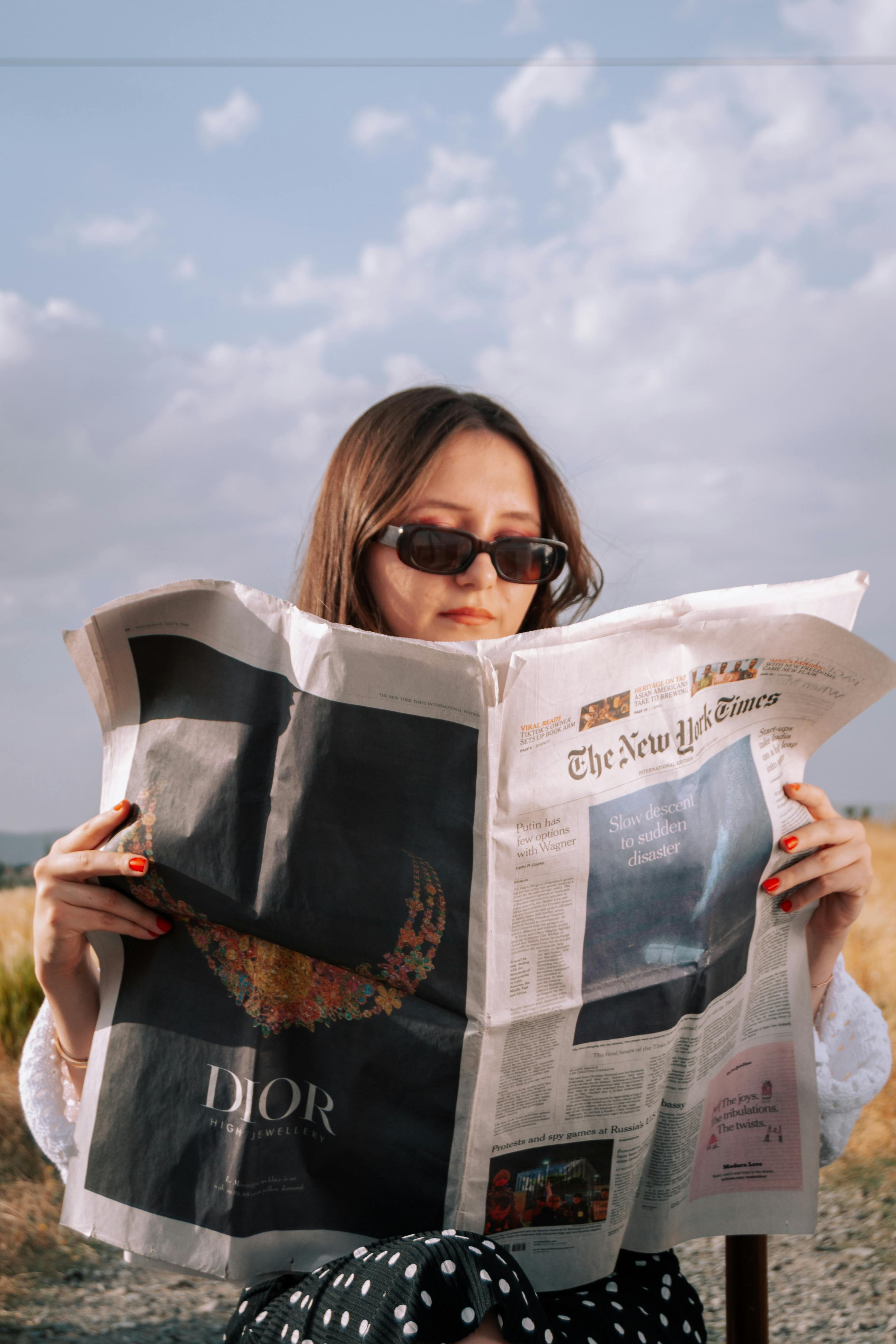 Man in Sunglasses Reading Newspaper · Free Stock Photo