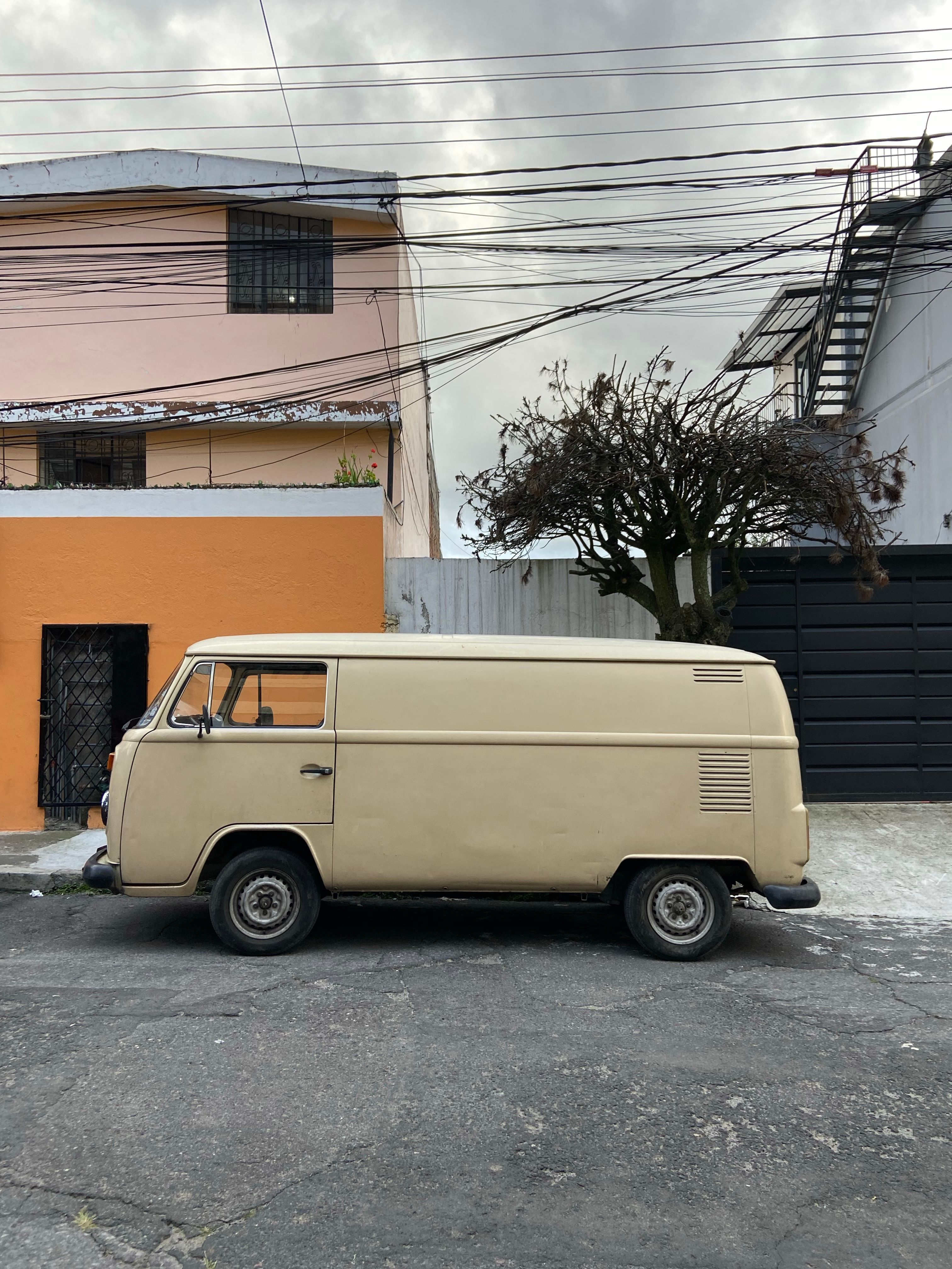 A Vintage Van Parked on the Side of a Street · Free Stock Photo