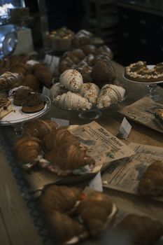 Delicious croissants and pastries displayed in a cozy bakery setting, perfect for food lovers.