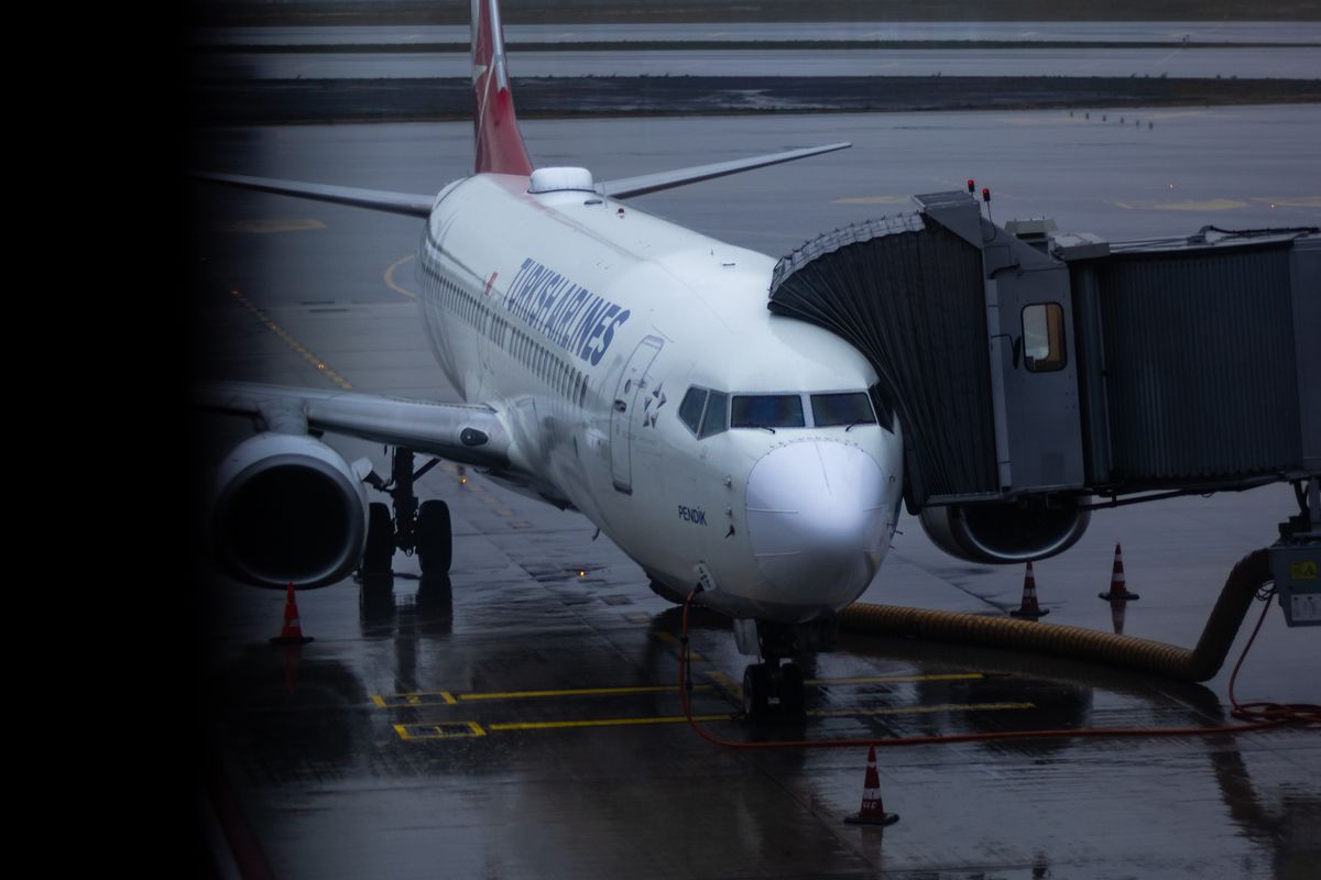 Aircraft parked at a boarding gate