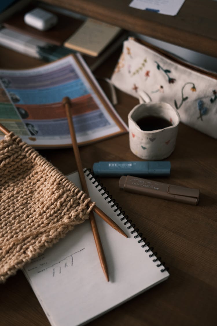 Notepad And Highlighters On Desk