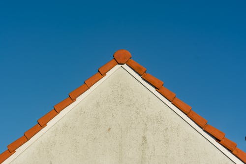 Roof of a House in Front of Blue Sky 
