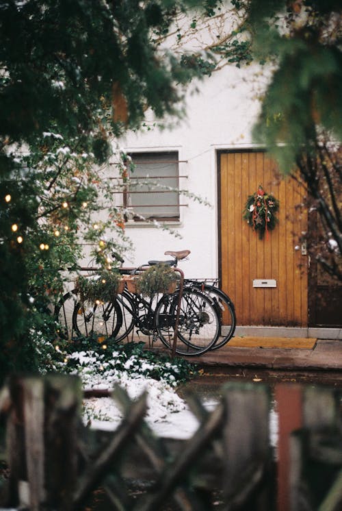 Bicycles by Door with Christmas Wreath