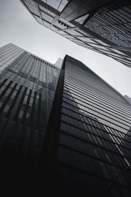 Low angle view of modern skyscrapers in New York City, showcasing urban architecture.